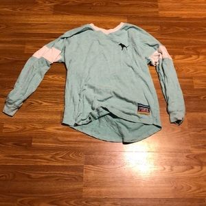 A pink sweater/shirt